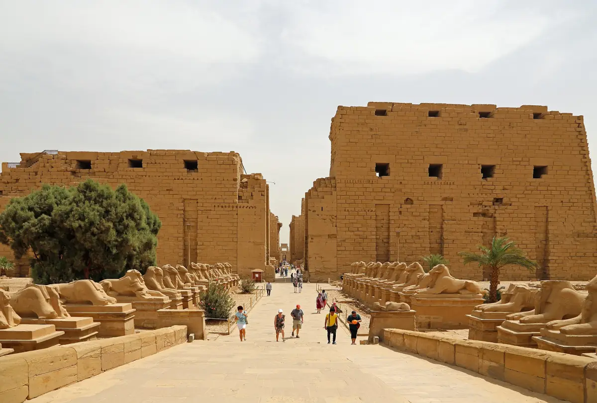 First pylon of Karnak Temple with a row of ram sphinxes in daylight