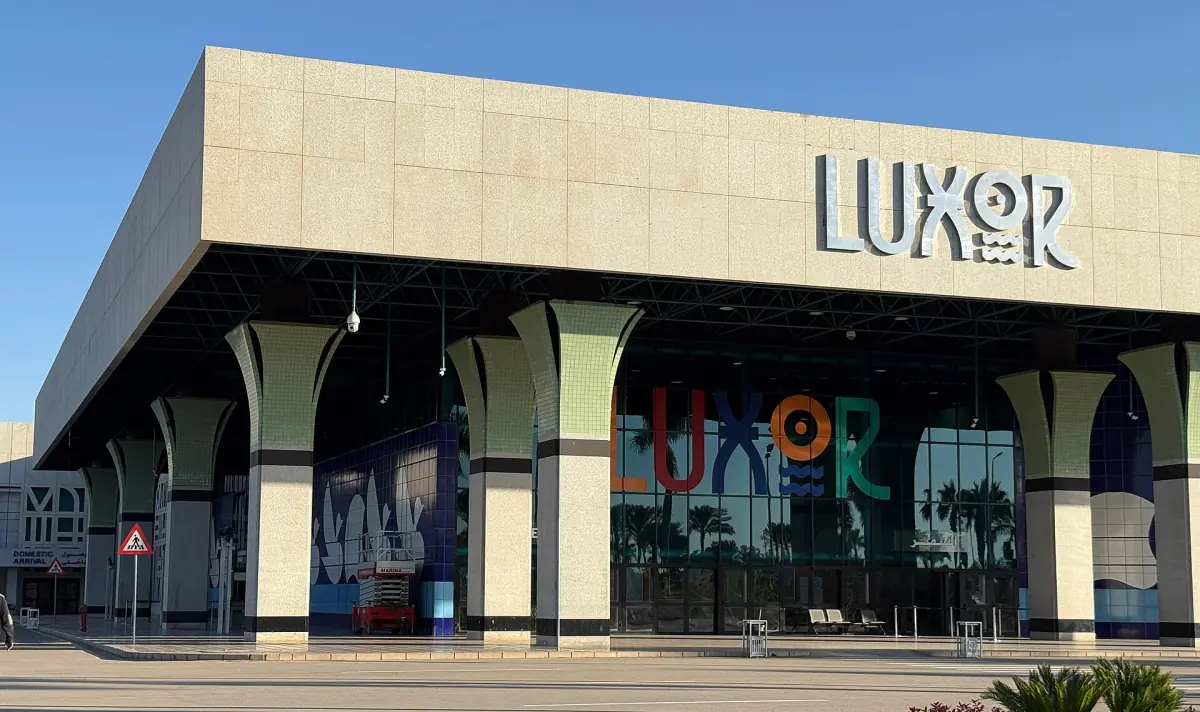 Entrance facade of Luxor International Airport terminal with the Luxor sign
