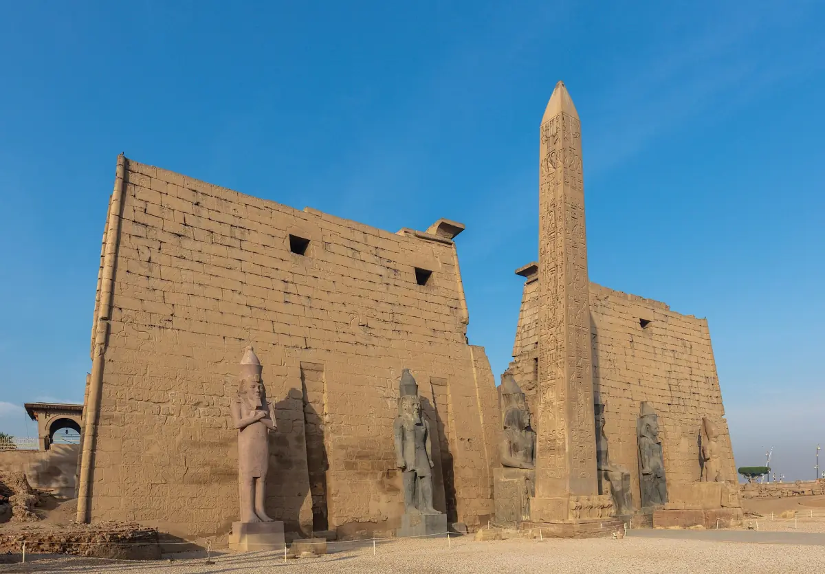 Pylon of Luxor Temple with the obelisk and colossal statues of Ramesses II
